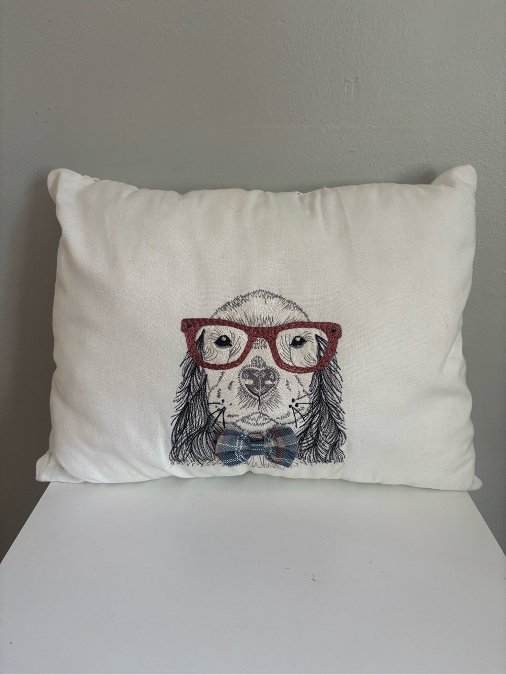 White Decorative Dog Pillow with Red Glasses and Plaid Bow